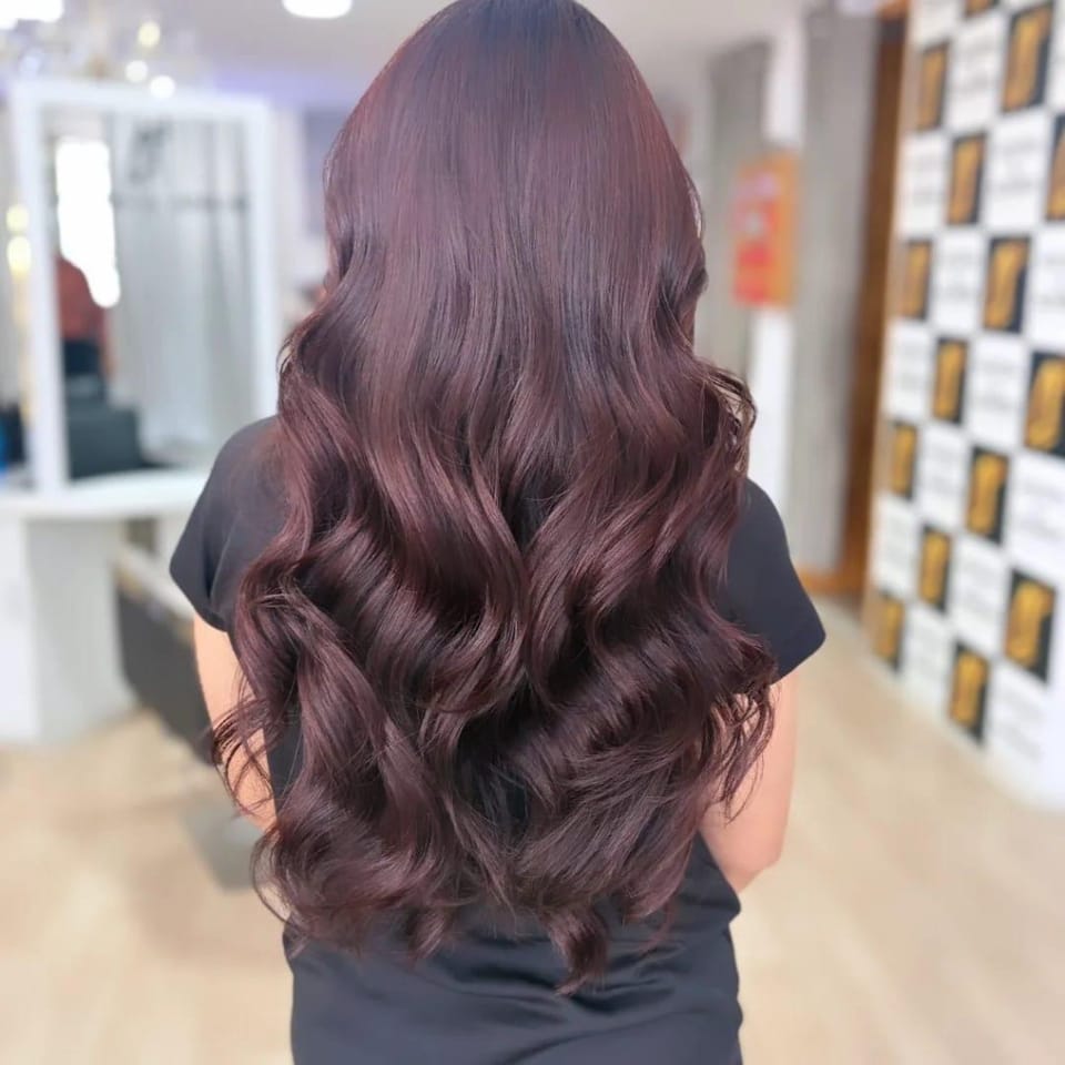 Mahogany burgundy colour with long glossy waves