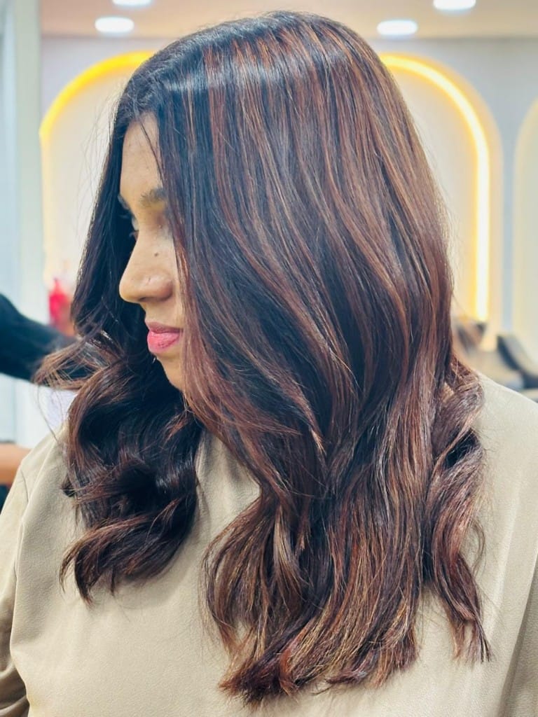 Warm copper balayage with voluminous waves