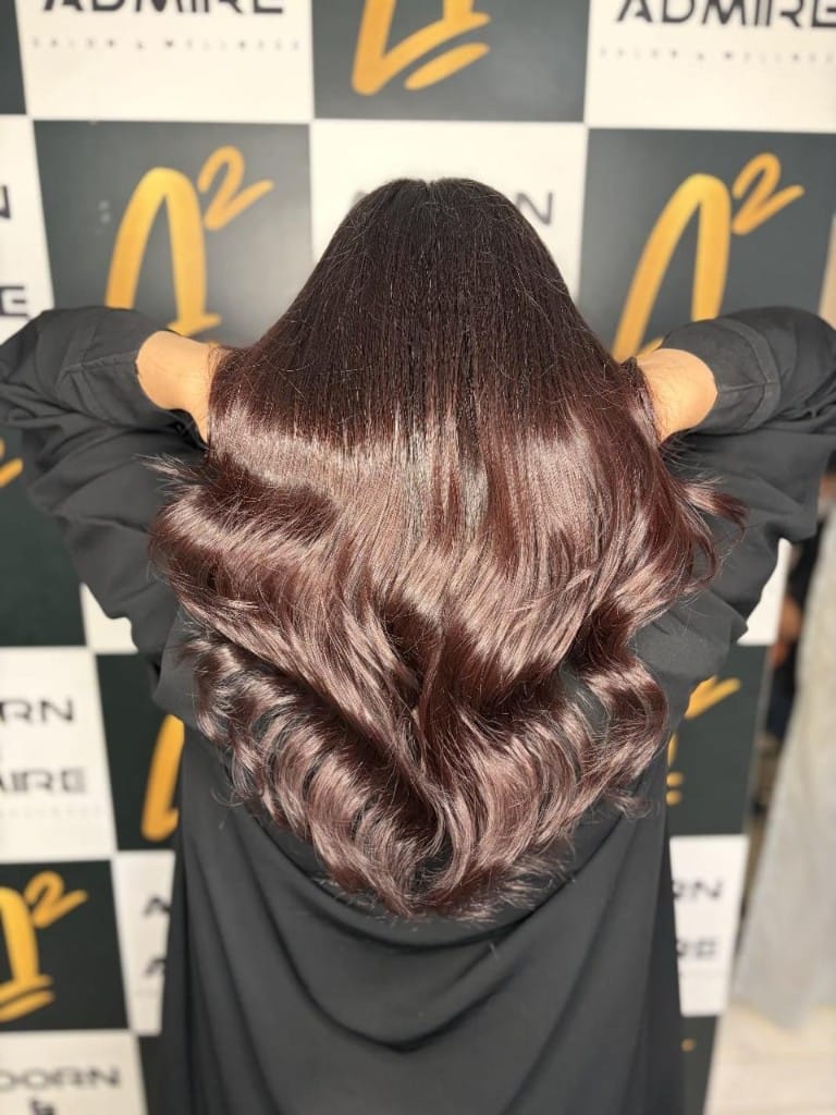 Mahogany auburn colour with bouncy curls and waves